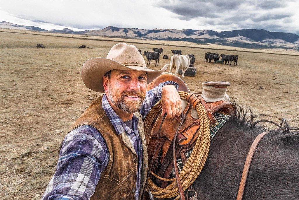 A cowboy with his black horse and cows in the background.